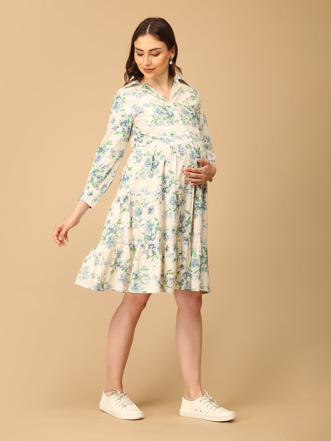 Woman wearing a floral dress on a beige background