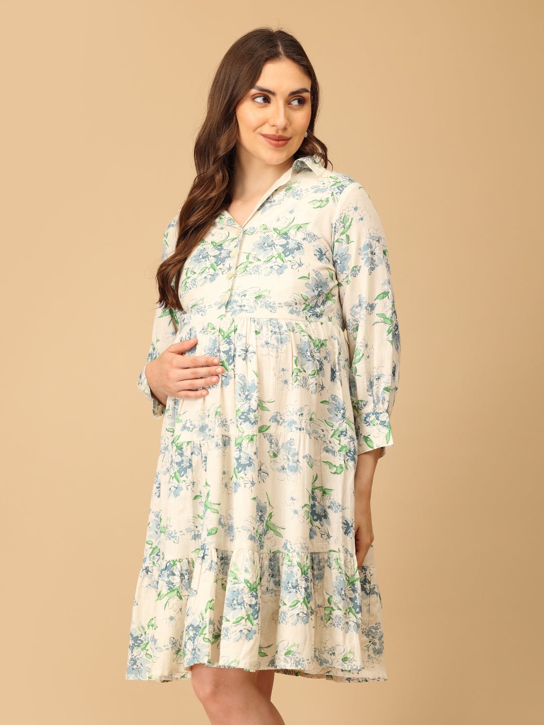 Woman wearing a floral dress against a beige background
