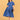 Model wearing Bluebell Beauty Maternity And Nursing Dress in blue floral print, front view with white sneakers