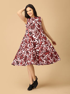 Woman wearing a sleeveless floral dress on a beige background