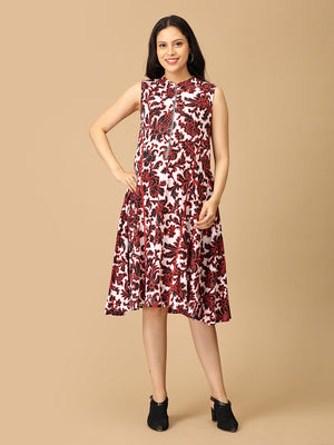 Woman wearing a sleeveless floral dress on a beige background