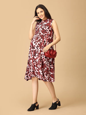 Woman wearing a red and white patterned dress with a red handbag on a beige background