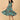Woman twirling in teal tiered floral maternity and nursing dress