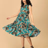 Woman twirling in teal tiered floral maternity and nursing dress