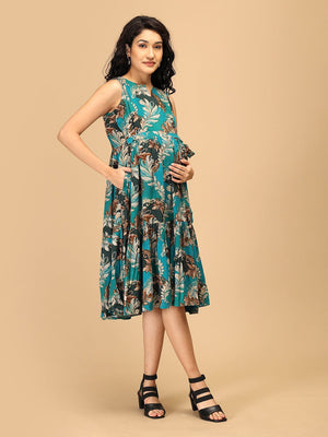 Side view of teal floral maternity dress with nursing access and pocket detail