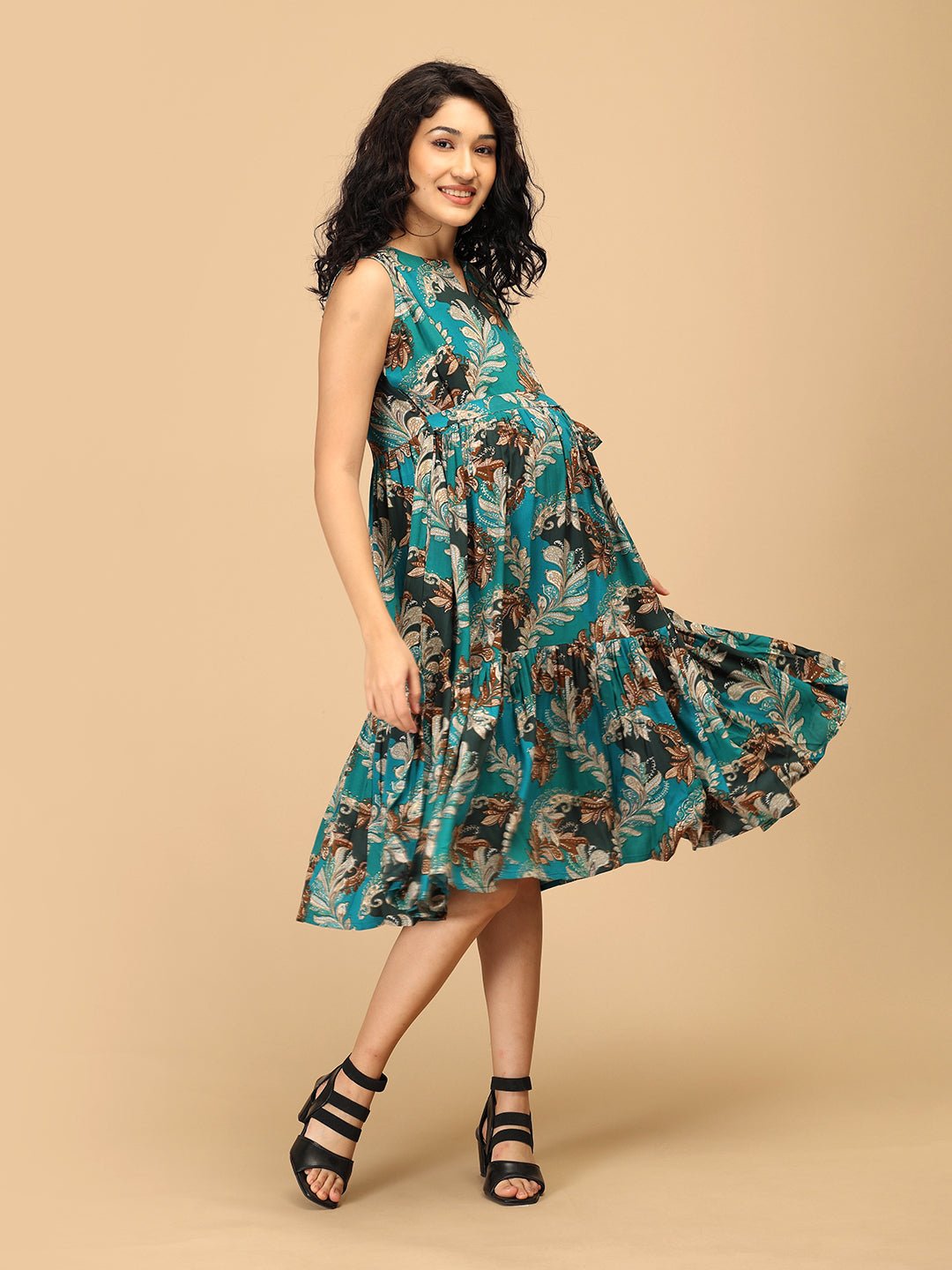 Front view of teal paisley-print maternity and nursing dress with empire waist