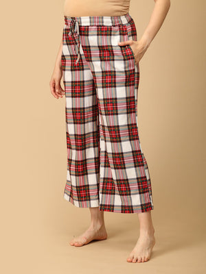 Trousers of a Pregnant model wearing Check Me In Maternity and Nursing Pajama Set from the mom store