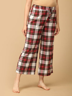 Trousers of a Pregnant model wearing Check Me In Maternity and Nursing Pajama Set from the mom store