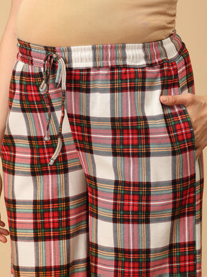 Close up of Trousers of a Pregnant model wearing Check Me In Maternity and Nursing Pajama Set from the mom store