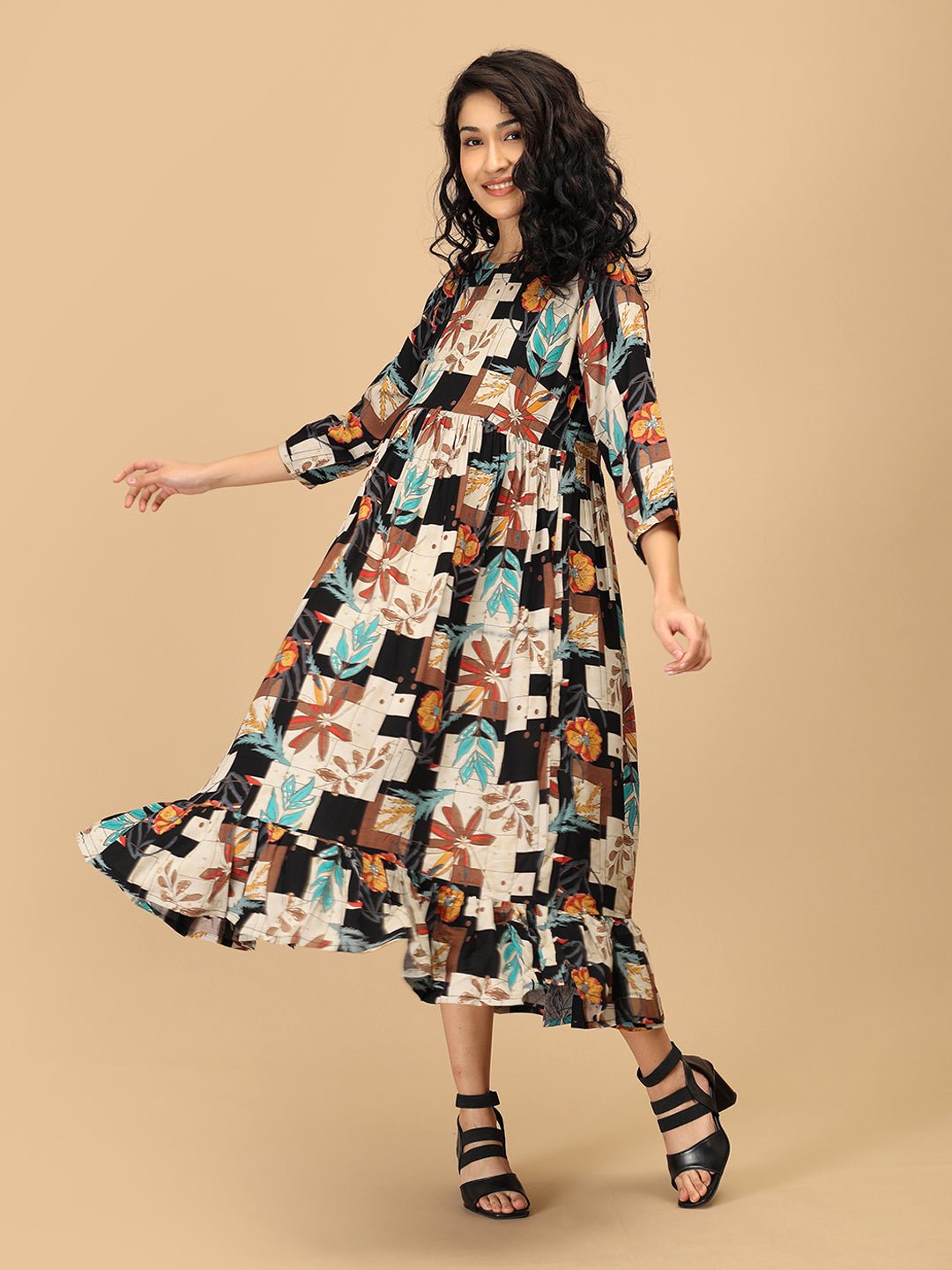 Side pose showing The Mom Store Chic Collage maternity dress with bump-friendly fit and pockets.