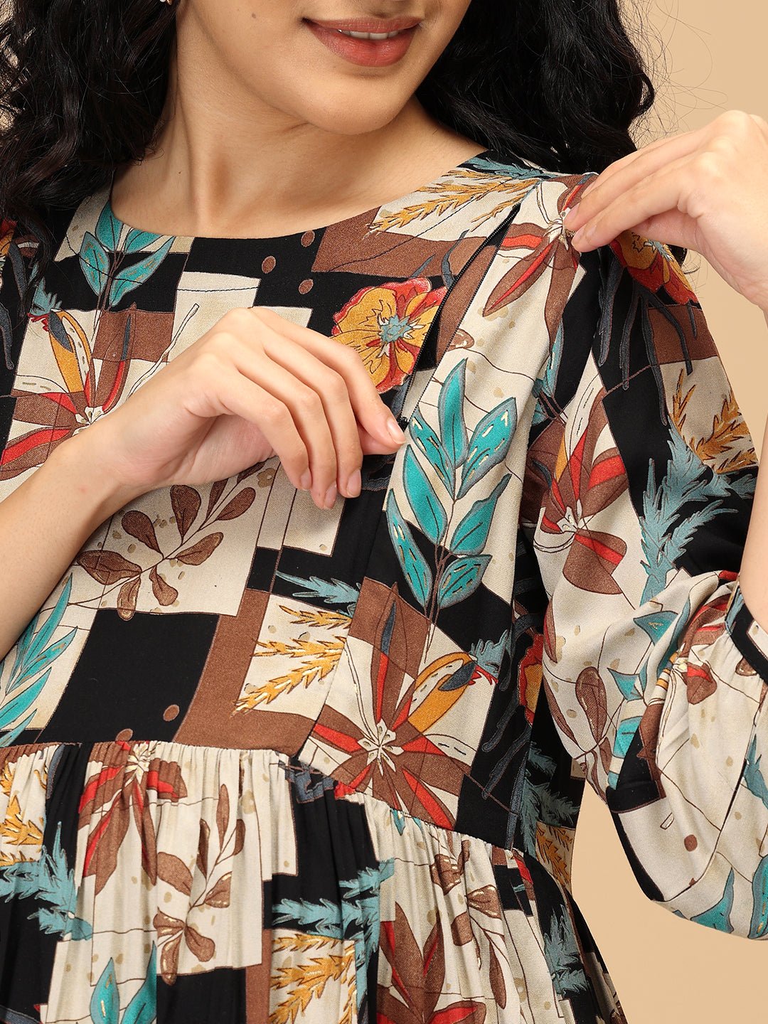 Close-up of The Mom Store Chic Collage maternity nursing dress with hidden zipper feeding access.