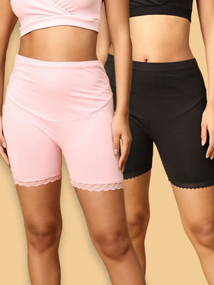 2 models wearing pink and black coloured high waisted mama boyshorts from the Mom Store