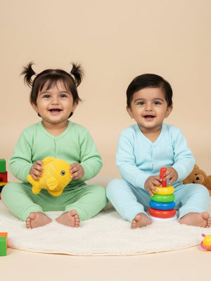 2 babies wearing Combo of 2 Pastel Blue & Green Coloured Infant Top and Bottom Set from the mom store