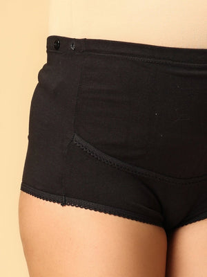 Side view of black coloured over belly support maternity panty from the mom store showing adjustable bands