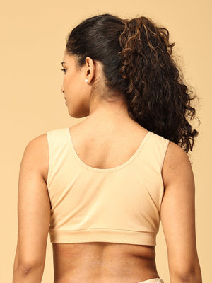 Backside view of Model wearing beige maternity nursing sleep bra from the Mom Store