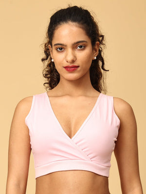 model wearing pink maternity nursing sleep bra from the Mom Store