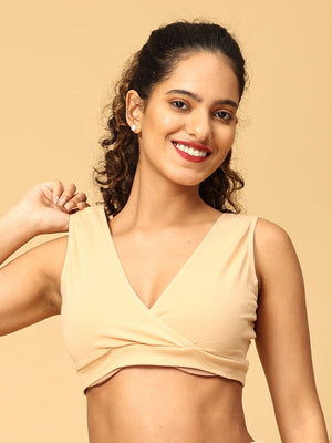 Model showing the strap of beige maternity nursing bra from the mom store