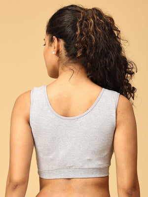 Backside view of Model wearing grey maternity nursing sleep bra from the Mom Store