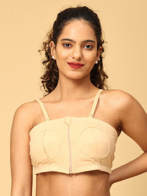 A model wearing a beige coloured nursing pumping bra from the mom store