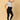 A pregnant woman wearing black maternity leggings with a wide, belly support waistband, paired with a short grey top.