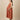Side view of Copper Daybreak Maternity and Nursing Shacket Dress with blue striped longline shacket over rust check dress