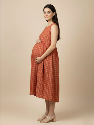 Side view of Copper Daybreak Maternity and Nursing Shacket Dress with blue striped longline shacket over rust check dress