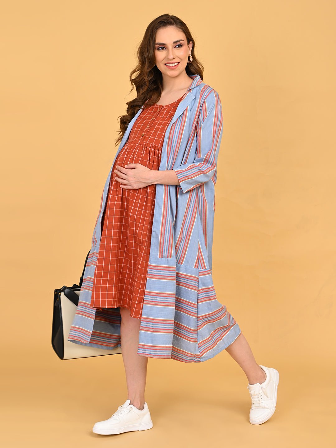 Full front view of Copper Daybreak maternity dress paired with blue striped long shacket.