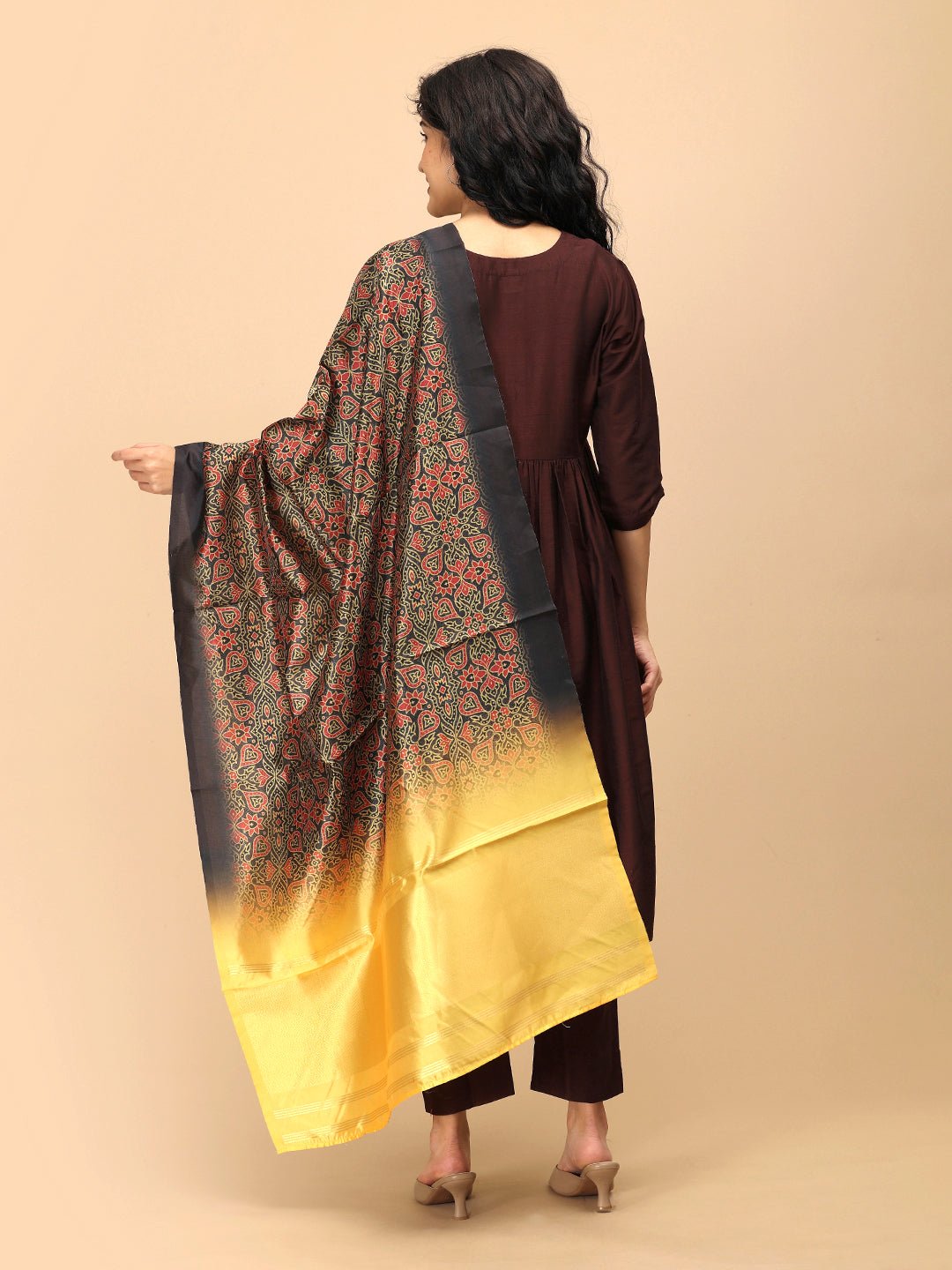 Back view of The Mom Store brown maternity silk kurta set styled with bold yellow-black printed dupatta.