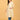 Pregnant model walking in cream maternity kurta with flowy silhouette and three-quarter sleeves.