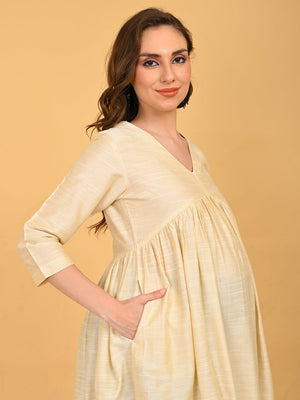 Upper body view of cream silk maternity kurta with V-neck and subtle sheen finish.