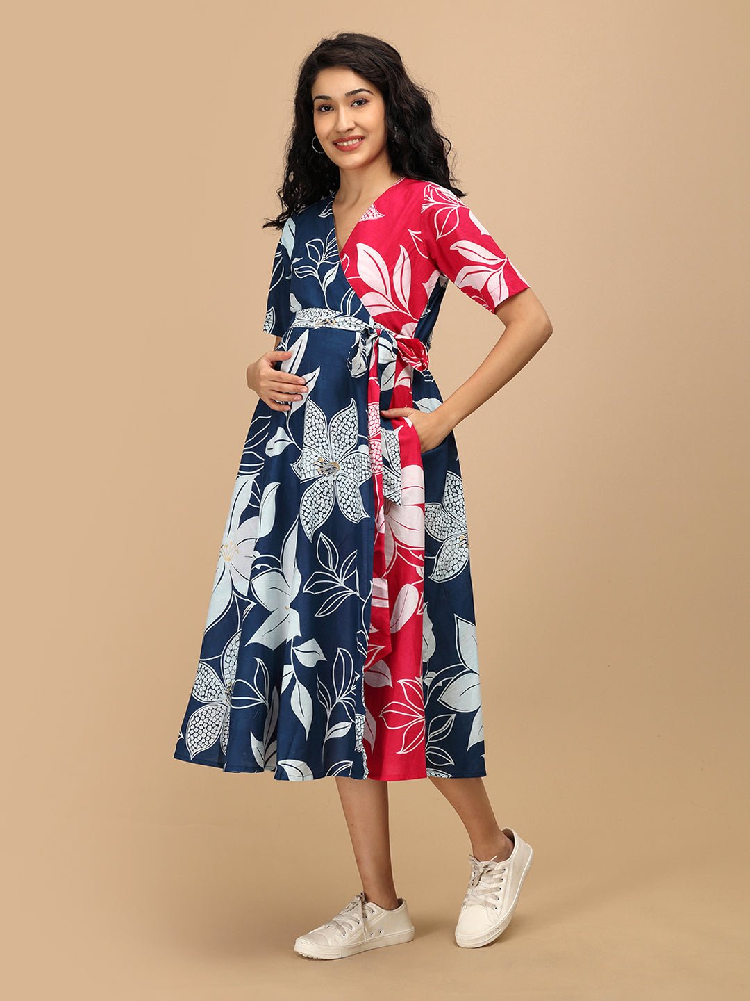 Front view of The Mom Store Dual Bloom maternity wrap dress in navy and pink floral print.
