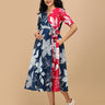 Front view of The Mom Store Dual Bloom maternity wrap dress in navy and pink floral print.