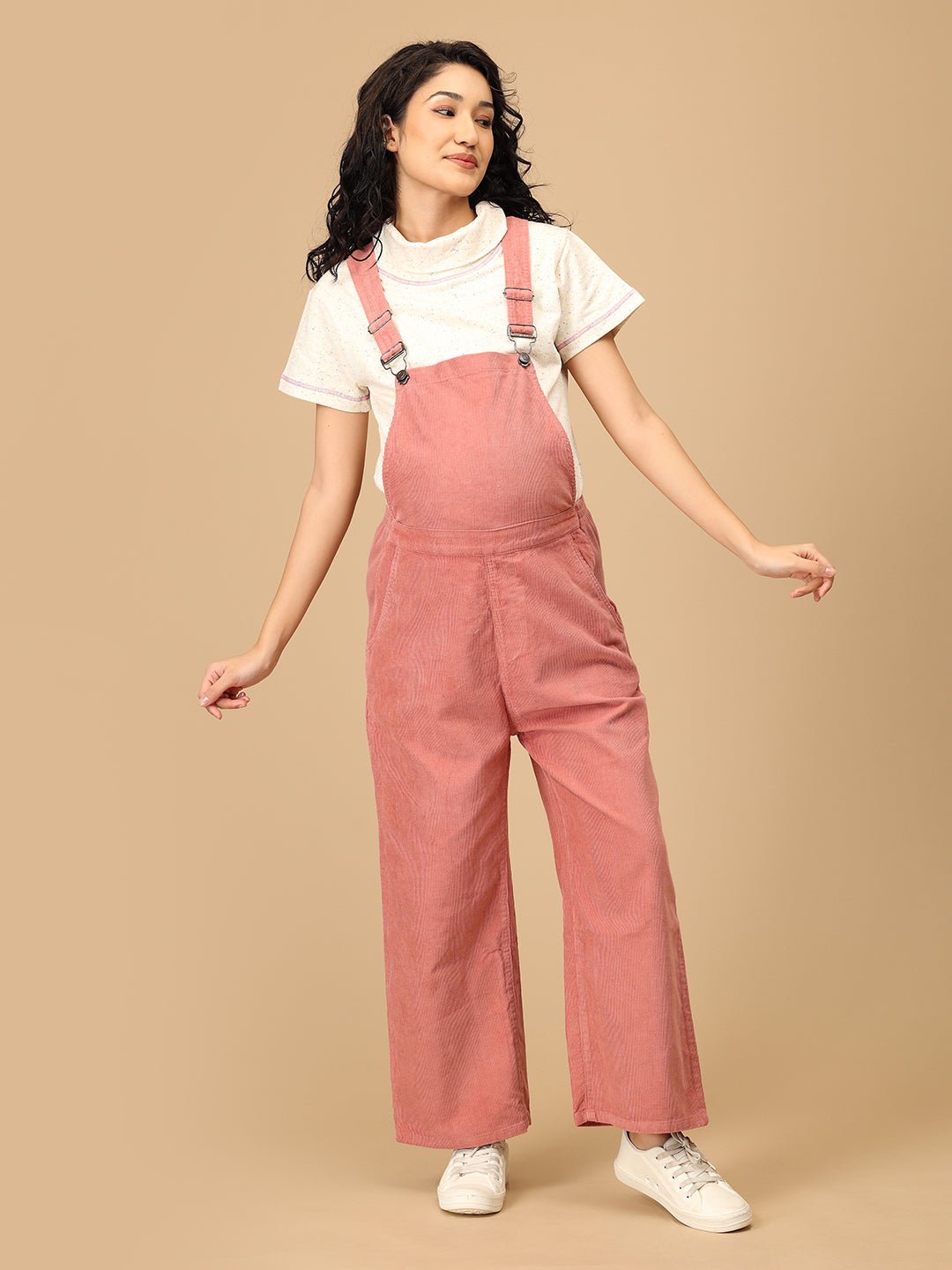 The Mom Store dusky rose corduroy maternity dungaree front pose showing wide-leg comfort fit.