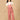 The Mom Store dusky rose corduroy maternity dungaree front pose showing wide-leg comfort fit.