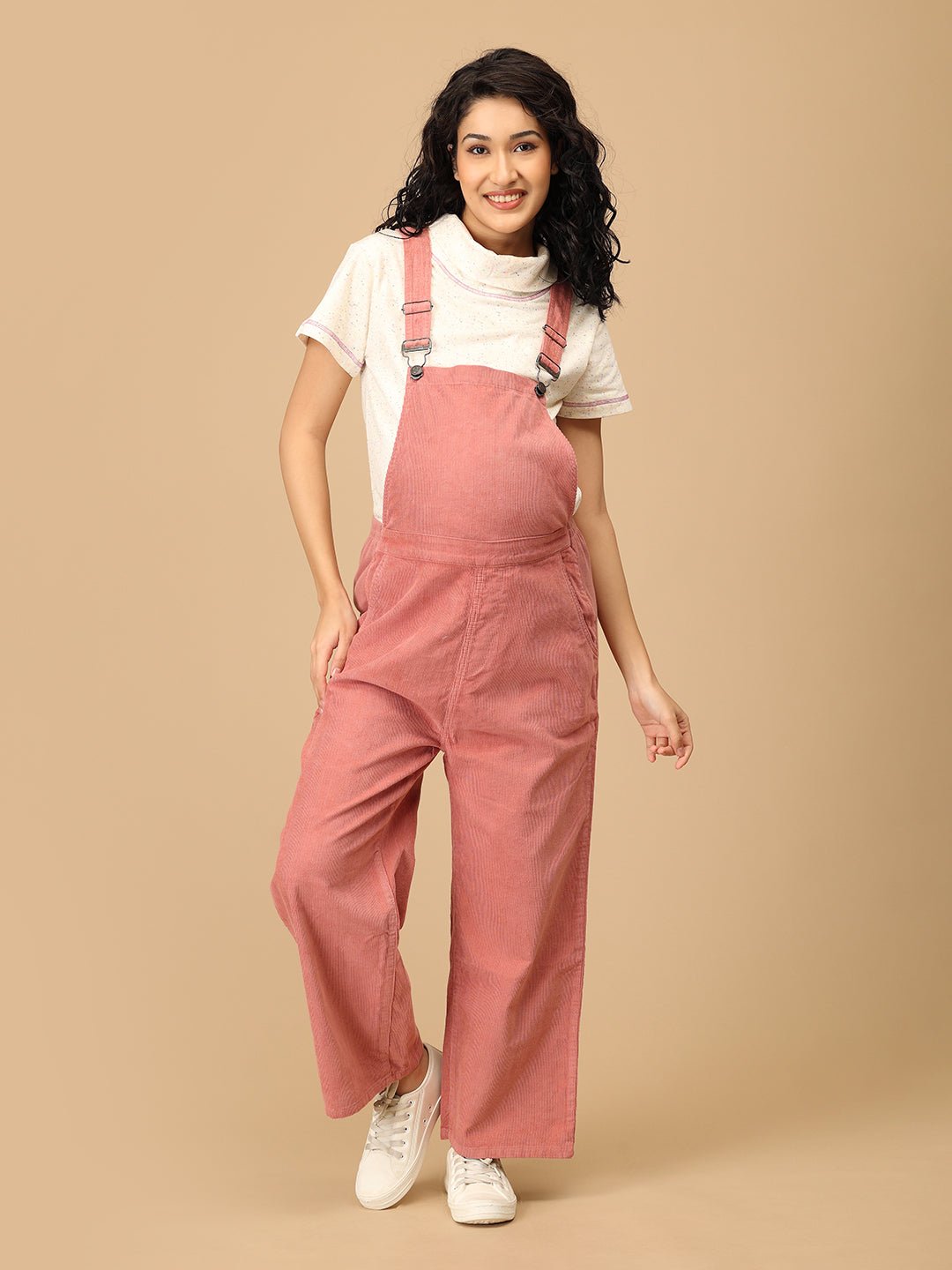 The Mom Store dusky rose corduroy maternity dungaree with adjustable straps front view.
