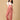 The Mom Store dusky rose corduroy maternity dungaree with adjustable straps front view.