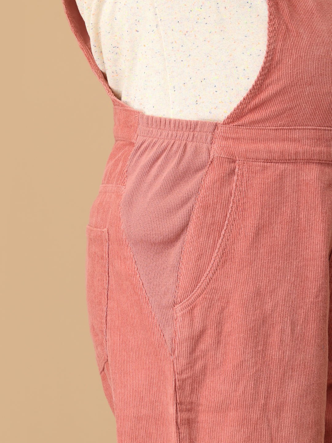 Ribbed side panel detail on The Mom Store dusky rose corduroy maternity dungaree for bump comfort.
