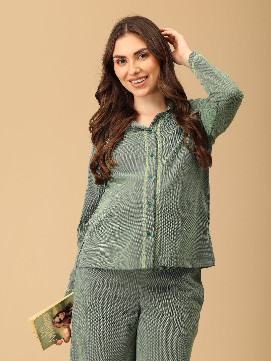 The Mom Store Evergreen Ease maternity pajama top in green, long sleeves, button-down, worn by smiling pregnant woman.