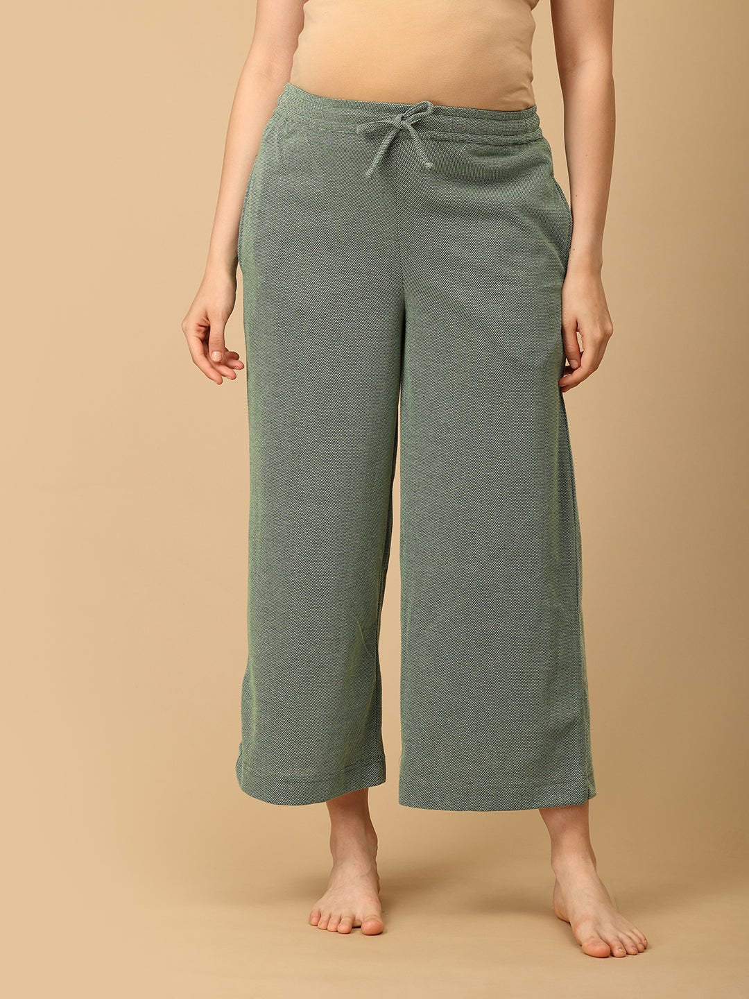 Front view of Evergreen Ease maternity pajama pants in green by The Mom Store, featuring soft knit fabric and drawstring waist.