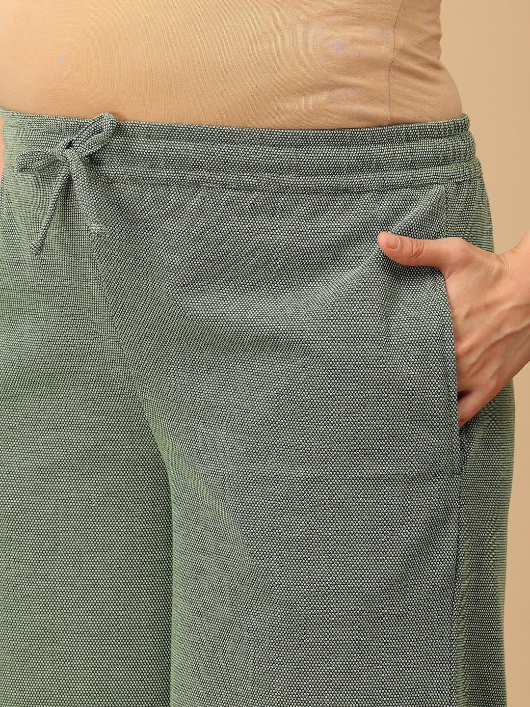 Close-up of The Mom Store Evergreen Ease maternity pajama pants featuring soft waistband and side pocket.