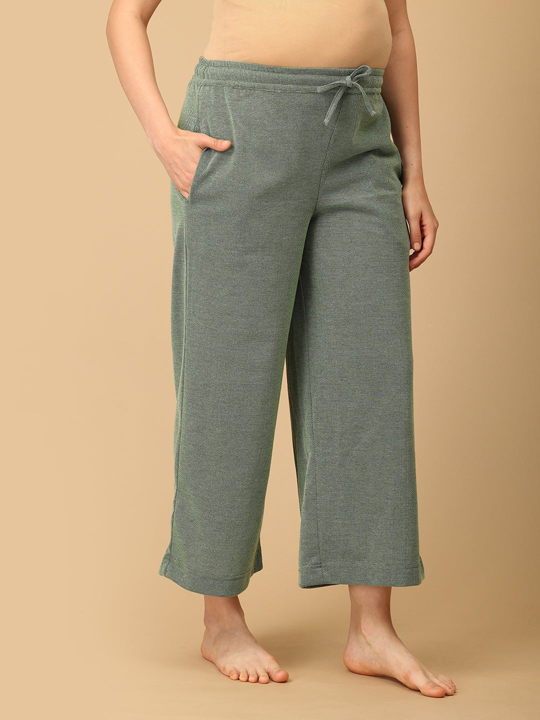 he Mom Store Evergreen Ease maternity lounge pants in green with elastic waist and ankle-length fit.