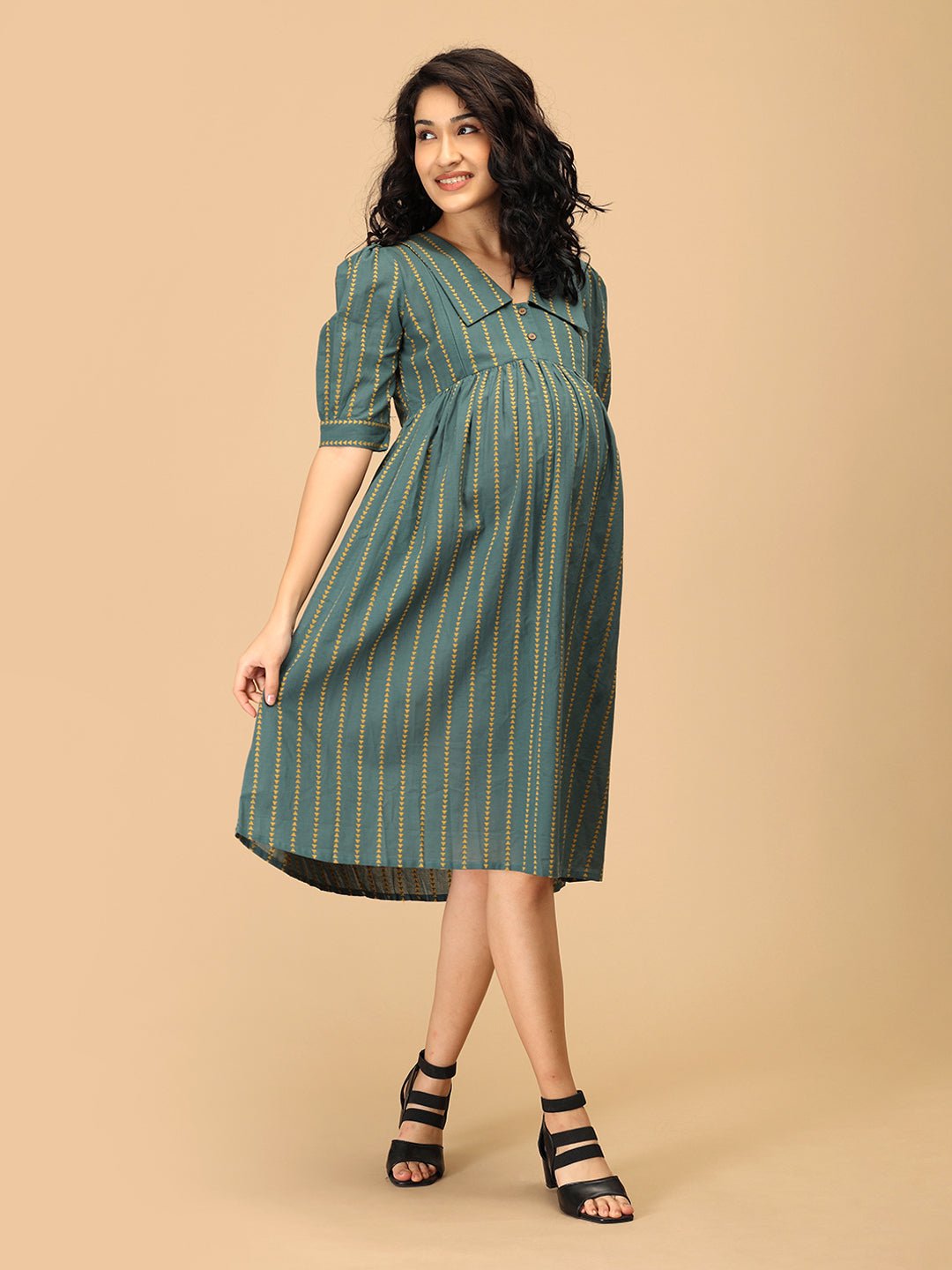 Full-length view of The Mom Store Everyday Ease maternity dress with striped pattern and V-neck collar.