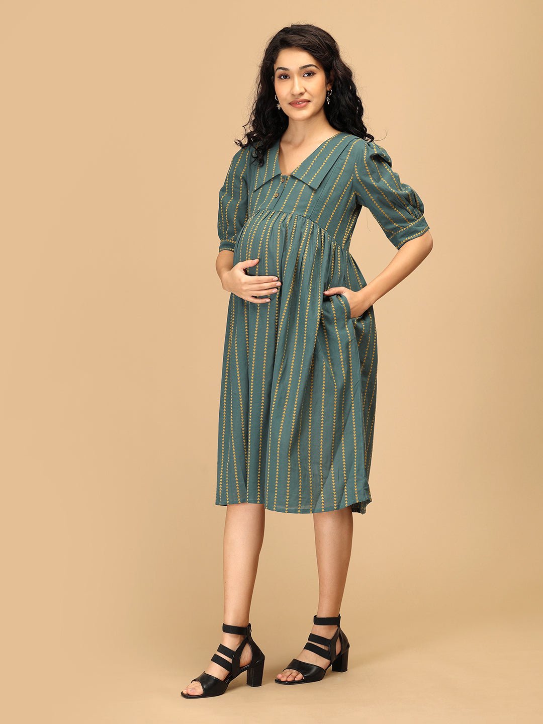 Side pose of The Mom Store Everyday Ease maternity dress featuring wide collar and puff sleeves.