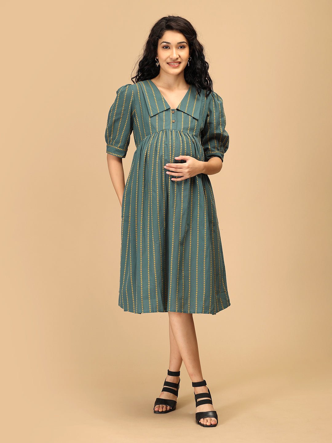 Front view of The Mom Store Everyday Ease maternity dress in green with mustard stripes.