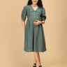 Front view of The Mom Store Everyday Ease maternity dress in green with mustard stripes.