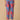 Front view of blue printed maternity pants with coral floral motifs and elasticated waistband.
