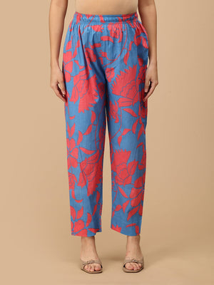 Front view of blue printed maternity pants with coral floral motifs and elasticated waistband.