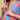 Close-up of concealed button-front nursing access on blue maternity kurta with coral print.