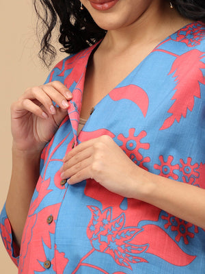 Close-up of concealed button-front nursing access on blue maternity kurta with coral print.
