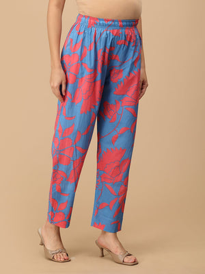 Side view of blue floral maternity pants highlighting breathable fabric and ankle-length cut.